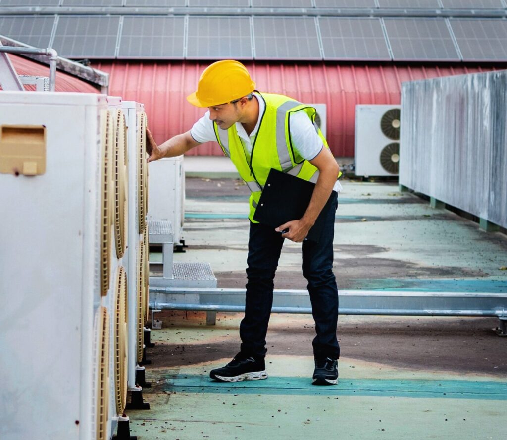 man in a yellow vest is inspecting a building 2025 09 10 05 16 27 utc min | Buckeye Comfort Solutions